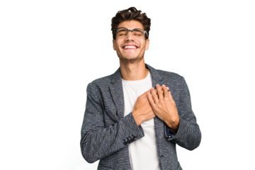 Young caucasian handsome man isolated laughing keeping hands on heart, concept of happiness.