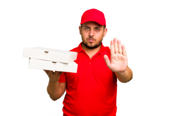 Pizza delivery caucasian man with work uniform picking up pizza boxes isolated standing with outstretched hand showing stop sign, preventing you.