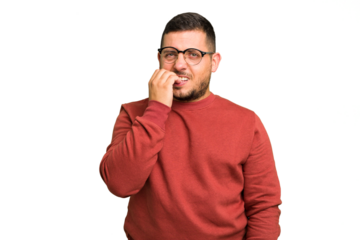 Young caucasian man isolated biting fingernails, nervous and very anxious.