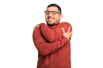 Young caucasian man isolated hugs, smiling carefree and happy.