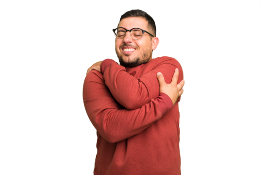 Young caucasian man isolated hugs, smiling carefree and happy.