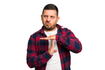 Young caucasian man isolated showing a timeout gesture.