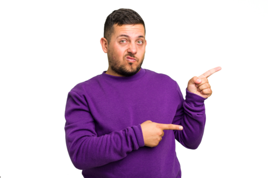 Young caucasian man isolated shocked pointing with index fingers to a copy space.