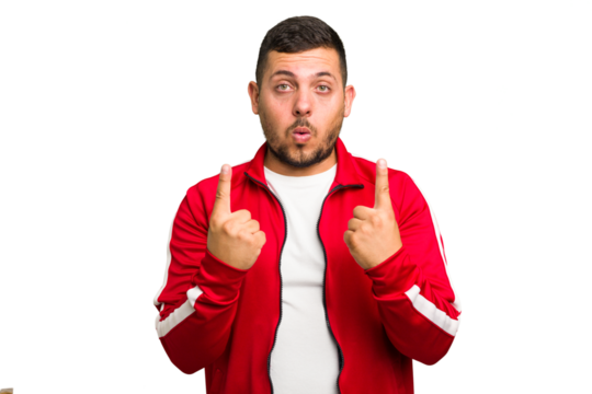 Young caucasian man isolated pointing upside with opened mouth. - Powered by Adobe