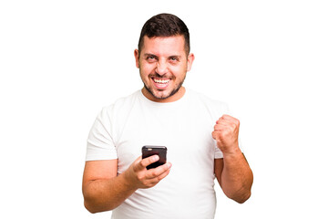 Young caucasian man using mobile phone isolated