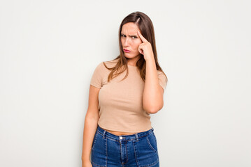 Young caucasian cute woman isolated on white background pointing temple with finger, thinking, focused on a task.