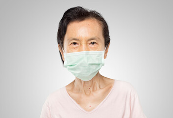 old asian woman have cold and wearing a virus mask worried about covid-19