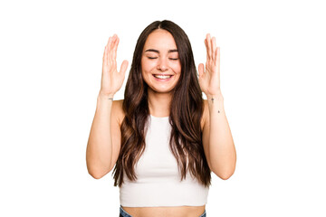 Young caucasian woman isolated on green chroma background joyful laughing a lot. Happiness concept.