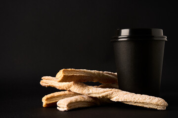 Paper coffee cup and Puff pastry sticks with cinnamon