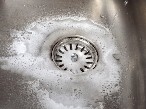 Sink drain cleaning process using baking soda and white vinegar