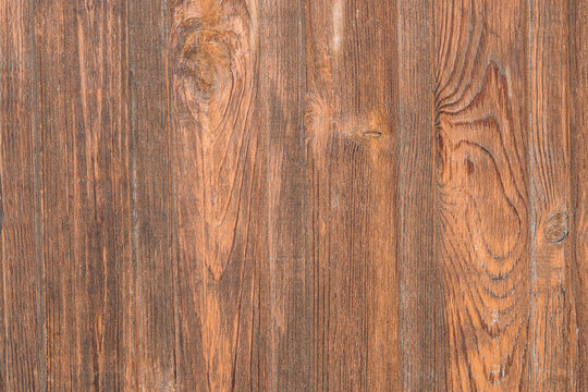 The background of the surface of a high-quality wooden image, a copy of the space. The texture of a brown wooden board with natural patterns, varnished