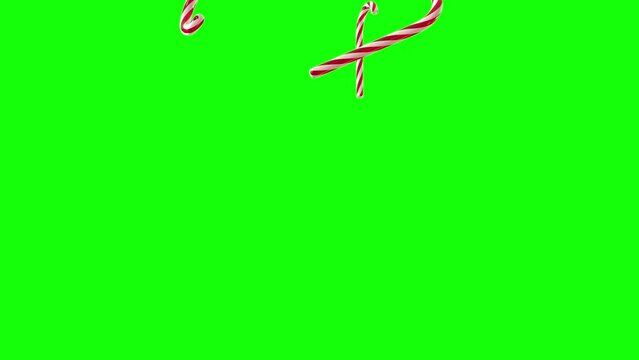 A rain of red, green and white candy canes falling on green scren background, 3D animation