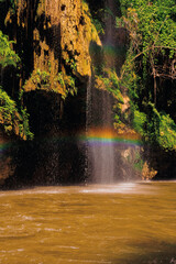 Fototapeta na wymiar waterfall in the forest with a rainbow at Thi Lo Su Waterfall