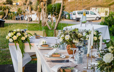 Served and decorated with flowers and candles table ready for the party or celebration dinner. 