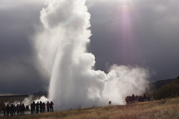 Fototapeta na wymiar Strokkur Erupting (a fountain-type geyser) located beside the Hvíta River at Haukadalur Geothermal Area, Iceland