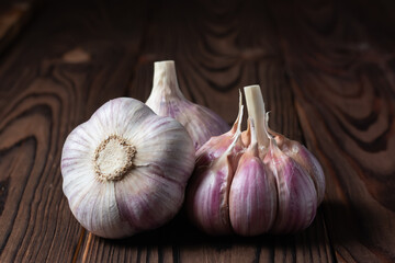 Garlic bulb on wooden background. Close up