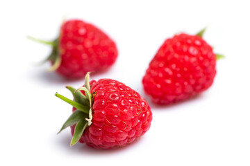 Closeup of red raspberry berries on white background