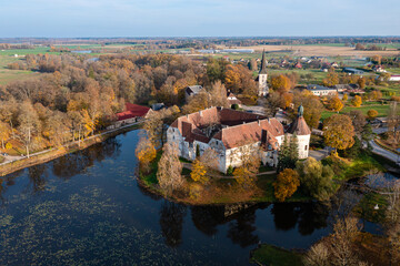Fototapeta na wymiar Jaunpils castle was built in 1301. as Livonia Order fortress. Latvia, view from above