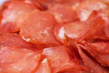 Top view of beef jerky pieces . Chewy and delicious beef jerky