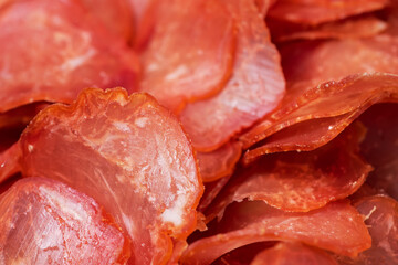 Top view of beef jerky pieces . Chewy and delicious beef jerky