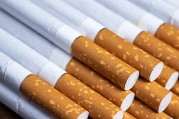 Many cigarettes stacked together. Drugs are harmful to the respiratory system.