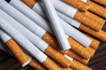 Many cigarettes stacked together. Drugs are harmful to the respiratory system.