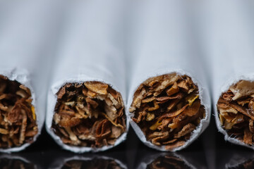 cigarette, cigarette on black background, pack of cigarettes, close-up of a cigarette