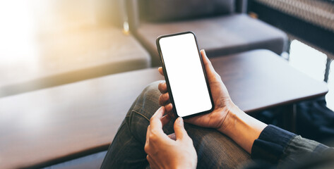 cell phone blank white screen mockup.hand holding texting using mobile on desk at office.background empty space for advertise.work people contact marketing business,technology