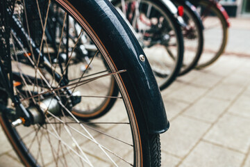 Many bicycles parked outside on the street of Halmstad in Sweden