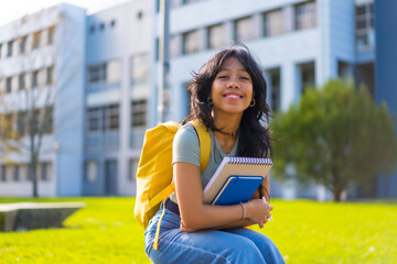 Asian girl on campus, student enjoying classes, smiling at university, sitting