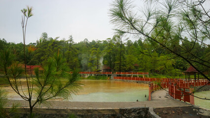 Hot spring lake with green trees