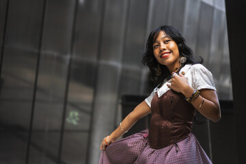 An Asian girl in a vintage Asian traditional long dress, fashion photography