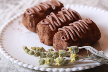 Chocolate cakes on a plate close-up