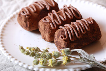 Chocolate cakes on a plate close-up