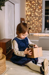 Fototapeta na wymiar Little child at home for christmas with gifts