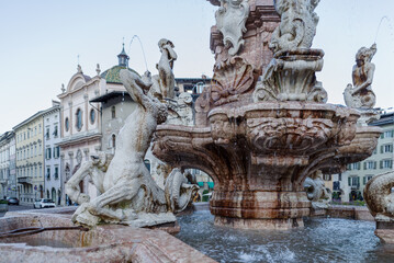 Fototapeta na wymiar Neptune fountain on Trento town square, Italy