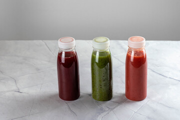 Colorful smoothie, healthy detox, vitamin diet or vegan food concentration. Fresh vitamins. Drink with spinach, kiwi, strawberries and cherries.