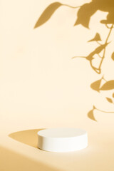 White podium for beauty cosmetics on beige background. Suitable for eco-friendly cosmetic products for face and body care.