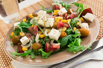 fresh vegetarian healthy vegetable salad with arugula and chees