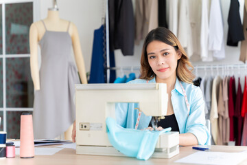 Asian women working together Small business, SME, tailoring designs for customers. Both of them acted as great designers.
