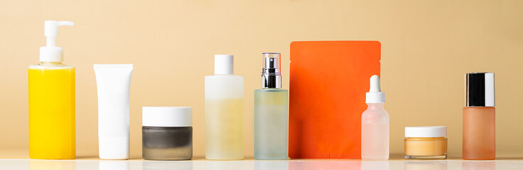 Skincare routine set , 10 step concept. Cleanser oil, foam, exfoliante, toner, essence, mask, serum, and cream cosmetic product on beige background. Banner