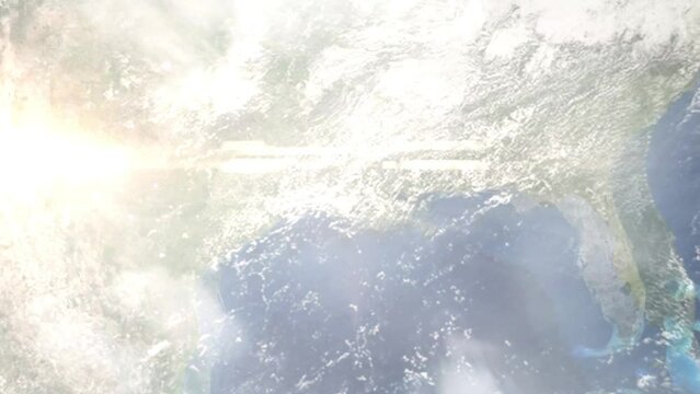 Earth zoom in from outer space to city. Zooming on Savannah, Georgia, USA. The animation continues by zoom out through clouds and atmosphere into space. Images from NASA