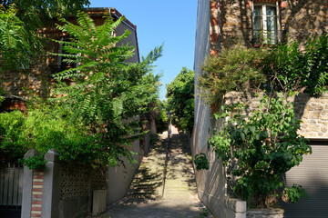 Fototapeta na wymiar Staircase to the countryside neighborhood in the 20th arrondissement of Paris city