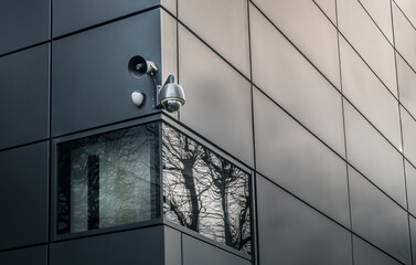Security camera or CCTV is outsite on the wall of the modern building. Video equipment for safety system area control outdoor, The concept of Professional surveillance, Selective focus.