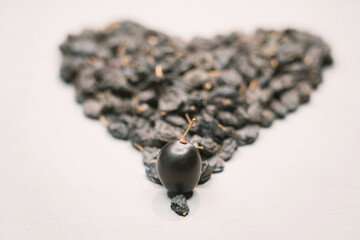 Blue raisin heart as a symbol of long life.