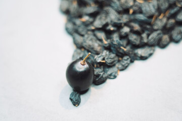 The combination of raisins and grapes in one photo.