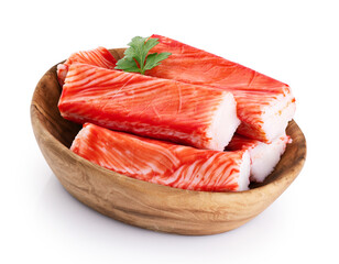 Crab sticks and parsley in a wooden bowl isolated on white background. With clipping path. © vitals