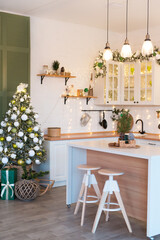 Modern Kitchen Interior with Island, Sink, Cabinets in New Luxury Home Decorated in Christmas Style
