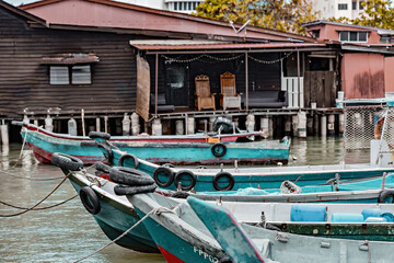 Fototapeta na wymiar Historical Chew Jetty with wooden fishing boats, Unesco World Heritage site, George Town, Penang, Malaysia