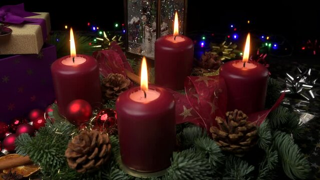 Advent wreath with lit candles slider shot to COVID19 mask and testing kit